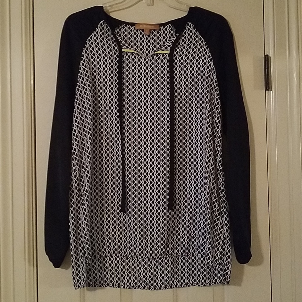 Black and white patterned blouse.